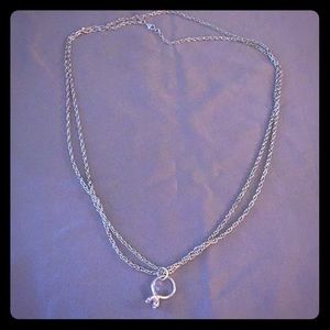 Silver necklace with ring charm